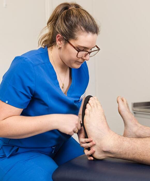 Prosper Health Group podiatrist fitting orthotics to patient in Highton