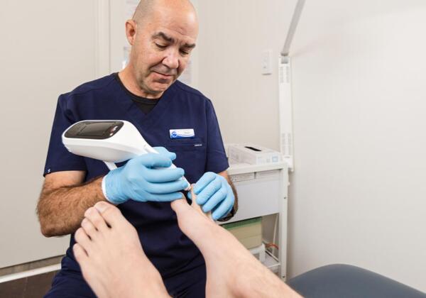 Prosper Health Group practitioner treating warts on patient at Highton clinic